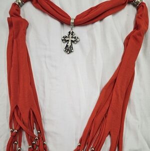 Orange scarf necklace with silver cross pendant
